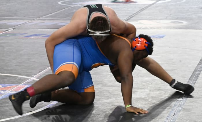 Kaden Darwin of Palmetto Ridge picks up a win against Tyranny McGowan in a 285-pound semifinal match on Saturday at the Knockout Christmas Classic at Silver Spurs Arena in Kissimmee.